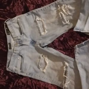 Men's light blue ripped distressed jeans. Size 34X32